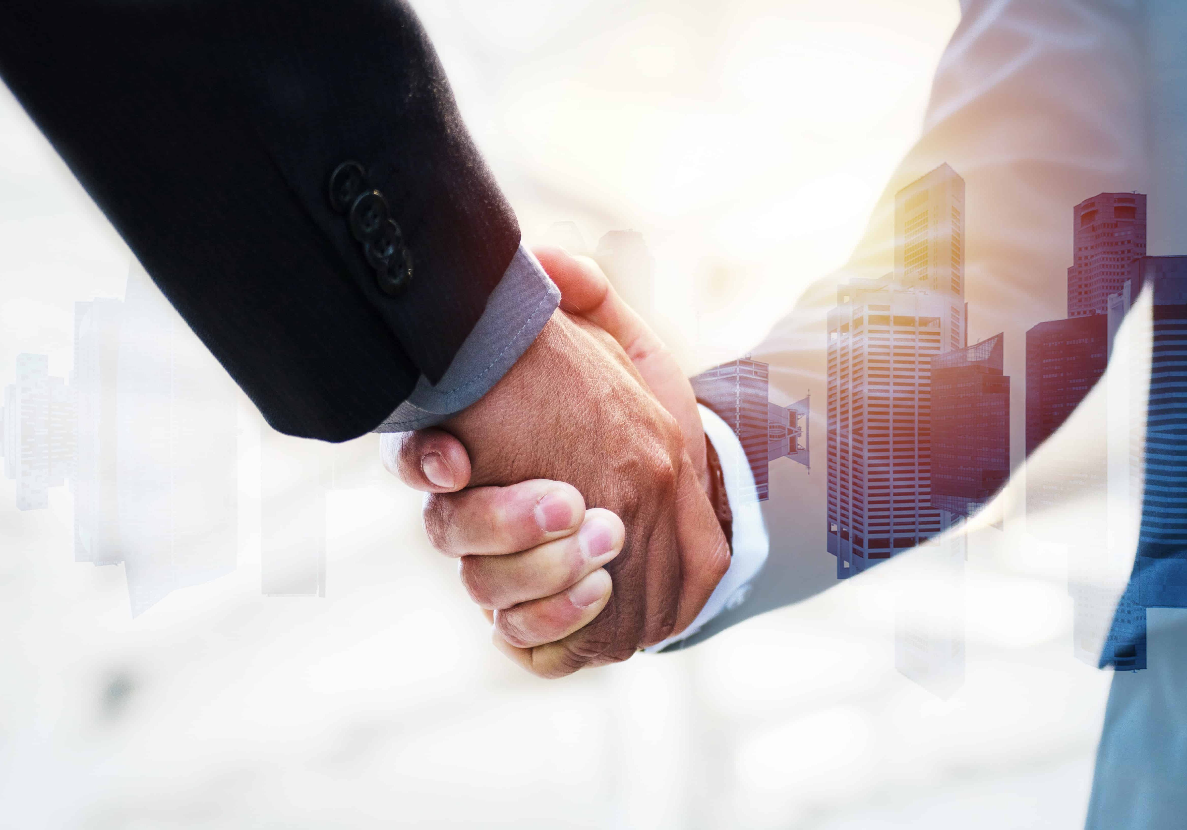 Partnership. double exposure image of investor business man handshake with partner for successful meeting deal with during sunrise and cityscape background, investment, partnership, teamwork concept